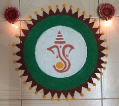 an image of lord ganeshi on the floor in front of lights and decorations