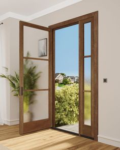 an open door leading to a view of the countryside through it's glass panels