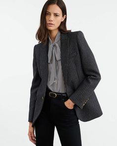 Single breasted slim blazer in Italian wool pinstripe. Signature crest buttons in gold. Chest welt pocket. Flap pockets. Full length sleeve. Fully constructed. Chest piece. Darts at front. Center back vent. Fully lined. Pinstripe Outerwear For Winter Workwear, Pinstripe Outerwear For Winter Office, Pinstripe Outerwear With Double Button Closure For Office, Elegant Pinstripe Blazer For Office, Winter Pinstripe Suit For Workwear, Winter Pinstripe Suits For Work, Formal Pinstripe Wool Outerwear, Winter Pinstripe Suits For Workwear, Pinstripe Outerwear With Button Closure For Fall