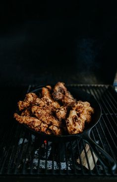 fried food is being cooked on the grill