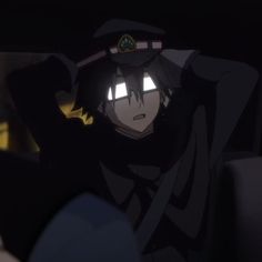 an anime character is sitting in the back seat of a car with his hand on his head