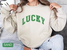 Crafted from a cozy cotton blend, our LUCKY crewneck is vintage-inspired with a relaxed fit that is perfect for any activity! This sweatshirt makes a great gift for St. Patrick's Day! SIZING: * Sizing is unisex * Runs true to size * For an oversized look, we suggest to size up 1 to 2 sizes 💕 CARE INSTRUCTIONS 💕  Machine wash: cold (max 30C or 90F); Non-chlorine: bleach as needed; Tumble dry: low heat; Do not iron; Do not dry-clean. ⭐ RETURNS AND EXCHANGES ⭐ All items are made with care and high-quality production standards. Because our products are made to order, we do not accept returns or exchanges due to incorrect sizing or other user errors. However, in the rare case that your item arrives damaged or not up to your expectations, please reach out to us within 3 days of receiving your St. Patrick’s Day, Distressed Sweatshirt, Oversized Look, St Patrick Day Shirts, Mama Sweatshirt, Saint Patrick, Holiday Sweater, Oversized Sweatshirt, New Arrival Dress