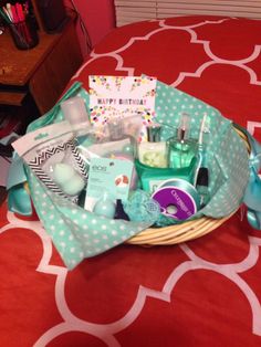 a basket filled with personal care items on top of a red tablecloth covered floor