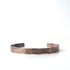 Simple copper cuff bracelet for men. Hammered cuff is oxidized for a more distress look. Wear it alone or stacking with other cuffs, a watch or chain bracelet.Materials: CopperSize: 1/4" WideSee sizing chart for correct size.MADE IN AMERICAWe take pride in our products, quality and the sourcing of our materials. You can rest assure that all of our products are handmade here in the U.S. and our materials are sourced and purchased from fellow American small businesses and companies. Jade Accessories, Hammered Cuff Bracelet, Bracelet Materials, Leather Bow Tie, Wardrobe Upgrade, Personalized Cufflinks, Copper Cuff Bracelet, Mens Bracelet Silver, Copper Cuff