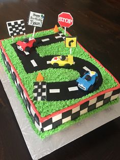 a birthday cake that is shaped like a race track