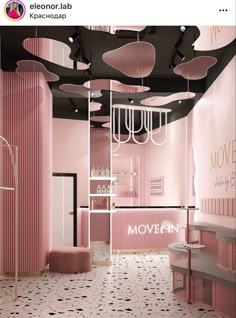 a pink and black room with chandeliers hanging from it's ceilings