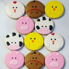 several decorated cookies are arranged in the shape of farm animals