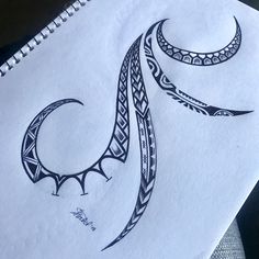 a drawing of a crescent moon on paper