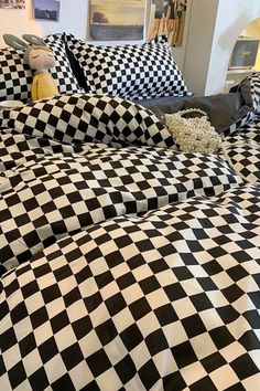 a black and white checkered comforter on a bed