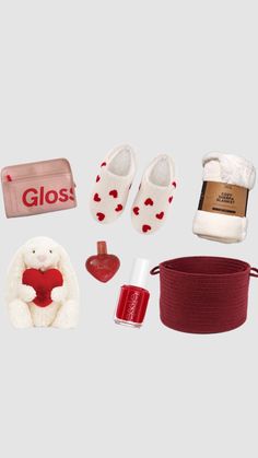 an assortment of items that include slippers, socks and a teddy bear with a red heart