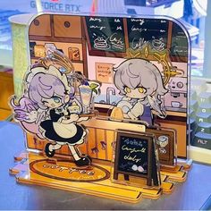 two anime characters are standing in front of a small counter with a chalkboard on it