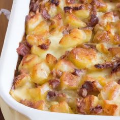 a casserole dish filled with potatoes and bacon