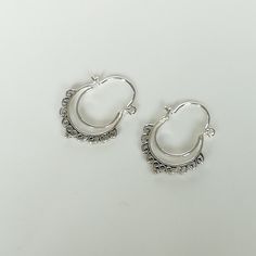 Indian style sterling silver ethnic hoops. Dimensions: 19 x 24 mm Price listed is for ONE PAIR. These earrings are made of 925 hypoallergenic sterling silver. Please note this price is for ONE PAIR only. All my pieces are sent in a gift box. I can include a personal message from you if needed You are welcome to contact me at... bhavnakwintra1956@gmail.com For more beautiful pieces from my shop, please browse 👇 TOE RINGS: https://www.etsy.com/your/shops/TheSilverGame/tools/listings/section:27020 Adjustable Silver Hoop Earrings, Silver Adjustable Hoop Earrings, Silver Hoop Wrap Earrings For Pierced Ears, Silver Hoop Wrap Earrings, Traditional Silver Hoop Earrings With Ear Wire, Silver Hoop Plug Earrings, Handmade Silver Small Hoop Wrap Earrings, Handmade Silver Small Hoop Earrings, Silver Hoop Earrings For Festival