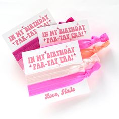 three pink and white birthday hair ties with tags on them that say i'm my birthday far - tay era