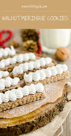 a close up of a cake with white frosting on it