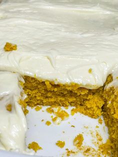 a cake with white frosting and yellow sprinkles on it's edges