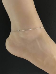 925 Sterling Silver Rhodium Plated Beaded Ankle BraceletANKLET FEATURES:Metal:  All components are made from solid .925 Sterling Silver Rhodium Plated Model is wearing 9" in length  solid .925 Sterling Silver Bead ChainChain Length:  9 inchYour Dainty Rolo Beaded Anklet will arrive in a gift box, beautifully wrapped and ready for giftingPlease send me a message if you have any questions before or after placing your order. Please also view my policy before purchasing. **************************** Elegant Sterling Silver Anklets For Summer, Elegant Summer Anklets With Round Beads, Silver Anklets With Tiny Beads For Summer, Adjustable Sterling Silver Anklets For Wedding, Elegant Adjustable Anklet With Tiny Beads, Delicate Adjustable Silver Anklets, Elegant Silver Anklets With Tiny Beads, Adjustable Sterling Silver Wedding Anklets, Delicate Silver Anklets For Summer