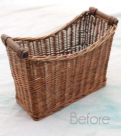 a wicker basket sitting on top of a bed