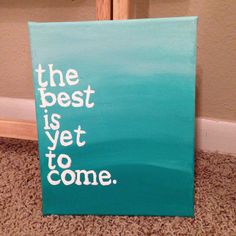 the best is yet to come painted on a canvas in front of a door frame