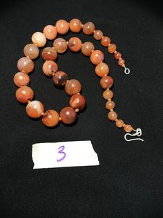 A beautiful 900 years old Pre Ankur carnelian beads necklace from Cambodia, worn by royals at that time as a luck charm. Glass beads as counters. In great condition and colors of the beads are exceptional with great shine on its surface as its been continuesly used since then till now. Carnelian Gemstone Round Beads, Carnelian Round Beads, Polished Round Carnelian Beads, Gems, And Cabochons, Carnelian Gemstone Beads Necklace, Natural Carnelian Round Beads Gemstones, Carnelian Gemstone Beaded Necklaces, Carnelian Beaded Necklaces With Gemstone Beads, Carnelian Polished Beads Necklace, Carnelian Beaded Necklace With Polished Round Beads