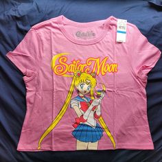 This Nwt Juniors Xl Crop Short Sleeve T-Shirt In Pink Features A Graphic Of Our Favorite Pretty Guardian Sailor Moon. This Is Officially Licensed And Is Made Of 50% Cotton And 50% Polyester. It Measures About 18.5 Inches Pit To Pit When Laid Flat. Measurments Are Approximate. I Am Open To Offers And I Encourage Bundles To Save On Shipping. Please Let Me Know If You Have Any Questions. Thank You! Pretty Guardian Sailor Moon, Cropped T Shirt, Crop Tshirt, Sailor Moon, Bundles, Let Me, Womens Sizes, Womens Tops, Tops & Tees