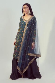 Teal kurta with floral printed motifs and embroidered neckline. Comes with palazzo pants and net dupatta.
Component: 3
Pattern: Print, Embroidery
Type Of Work: Floral Print, Dori and Sequin Work
Neckline: V neck
Sleeve Type: Full
Fabric: Dupion Silk and Net
Color: Blue
Other Details: 
Dupatta with embroidered border
Side slits
Embroidered neckline and cuffs
Occasion: Wedding - Aza Fashions V Neck Kurta, Kurta Palazzo Set, Palazzo Set, Dupion Silk, Embroidered Neckline, Net Dupatta, Indian Fashion Designers, Pernia Pop Up Shop, Fashion App