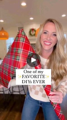 a woman holding two large red and green plaid pillows in her hands with the words, one of my favorite diys ever