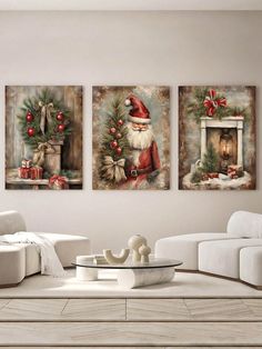 three christmas paintings on the wall in a living room