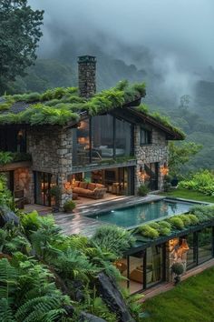 a house with a pool surrounded by lush greenery on the roof and side walls