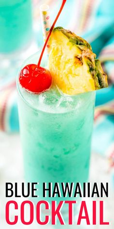 a blue drink with a pineapple on the rim and a cherry garnish