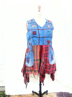 Upcycled Denim vest Boho clothing Western country top Plus size Hippie funky style Fall Winter fashion Recycled jeans Cowgirl Denim vest 1X-2X This one of a kind vest is  made from denim vest and red and gray plaid fabrics ,fit  sizes 18- 20- 22, big denim pockets, buttons closure, fringes and lots of heart appliques, cotton denim measurement take in flat: bust - 48" waist  - 46" length: back from shoulder - 41" There's more of handmade and unique clothing in my Etsy store https://www.etsy.com/shop/MilaLem ~ CARE INSTRUCTION: Machine wash cold water and Tumble dry low ~ INTERNATIONAL BUYERS I do not pay any duties, customs fees, or any other associated fees. These are the responsibility of the buyer if their country charges these types of fees. Please be aware of customs information includ Bohemian Sleeveless Winter Tops, Hippie Sleeveless Patchwork Tops, Upcycle Denim, Plus Size Hippie, Hippy Clothes, Heart Applique, Funky Style, Recycled Jeans, Denim Pocket