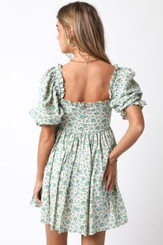 The Lorelei Mini Dress is your go-to for summer, featuring a blue and white floral print. With puff sleeves and ruffle detailing on the hem, neckline, and sleeves, this flowy linen dress exudes effortless elegance. Perfect for sunny days, it keeps you cool and stylish from brunch to beach strolls. Color: Blue Self: 100% Linen, Lining: 100% Rayon Hand wash cold, hang to dry. Item #2402-10LDJ Please call for in-store availability Size/Fit Model is wearing size S.