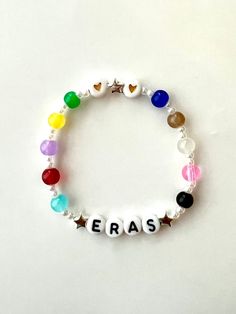 ...Ready For The Eras Tour 2024? ♡ ERAS tour friendship bracelets ♡ ♡ add your show & date for only $2!   ♡ standard sizing is 6.5"       -custom sizing available: please tell us size(s) needed in personalization section ♡ these are beaded bracelets handmade with durable, stretchy string ♡ great for trading at eras tour or adding to your bracelet collection!  ♡ message our shop for questions/concerns T Swift Bracelet Ideas, Word To Put On Bracelet, Eras Tour Bracket Ideas, Taylor Swift Thread Bracelet, Friendship Bracelets Ideas Words, Taylor Swift Eras Tour Bracelets Ideas, Eras Tour Brackets, The Eras Tour Bracelets Ideas, Era Tour Bracelets