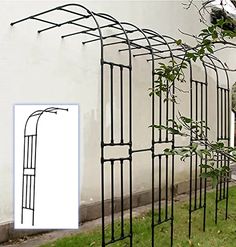 an iron garden trellis next to a white wall