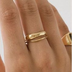 Two bands, cast from hand-sculpted wax models in the “Squiggle” silhouette, are perfectly made to stack with each-other or worn separately. Crafted to be enjoyed and admired, these two-tone rings will bring an artful and unique touch to any outfit. High polished to a high gloss in this bold, elegant ring. Wear it all day in anticipation of an evening out; it will not go unnoticed. Materials: Silver: Stainless Steel. Gold: 18K Gold Vermeil Stainless Steel 100% Eco-Friendly; No Nickel, Chromium an Rings Gold Plain, Cheap Dainty Gold Rings, Gold Colour Ring, Plain Solid Gold Ring, Attic Gold Ring, Knuckle Rings Gold Simple, Fingers For Rings, Genuine Gold Ring, Wode Gold Ring