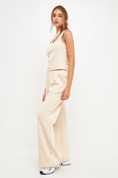 Step up your lounge game with our chic wide knit pants. These pants are sure to become your new favorite, whether you're relaxing at home or running errands. The wide leg and knit fabric give them a stylish look, while the beige cream hue makes them easy to pair with any top. Plus, they're so comfortable you'll never want to take them off! Wide pants Knit Elastic at waist Shell: 55% Cotton 43% Polyester 2% Spandex JJ941P XS Total length: 42.75", Waist: 26", Inseam: 30.5" Beige Athleisure Bottoms For Lounging, Comfortable Beige Pants For Lounging, Relaxed Beige Bottoms For Loungewear, Beige Casual Wide Leg Pants For Loungewear, Casual Beige Wide Leg Pants For Loungewear, Beige Casual Wide Leg Loungewear Pants, Casual Beige Wide Leg Loungewear Pants, Beige Straight Lounge Pants, Beige Soft Texture Bottoms For Lounging