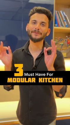 a man standing in front of a bookshelf holding his hands up with the words 3 must have for modular kitchen