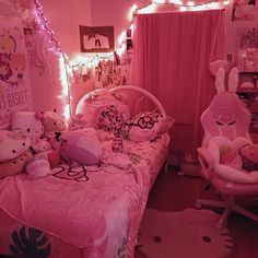 a pink bedroom with hello kitty decorations and lights