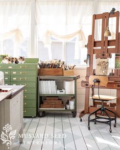 an artist's studio with lots of art supplies on the desks and shelves