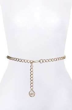 Update your ensemble with the modern sophistication of a goldtone chain belt complete with a logo medallion. Goldtone plate Imported Chic Gold Metal Waist Chain, Chic Metal Chain Belt With Chain Print, Gold Waist Chain With Chain Strap For Formal Occasions, Formal Gold Waist Chain With Chain Strap, Elegant Metal Chain Belt With Chain Print, Gold-tone Chain Belt For Formal Occasions, Formal Gold Metal Chain Belt, Chic Gold-tone Chain Strap Belt, Chic Gold Chain Belt With Strap