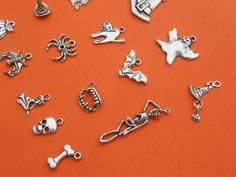 16 Different antique silver tone charms make up this set, ranging from 18 to 42mm Metal Nickel-free Silver Novelty Charms, Halloween Silver Charm Jewelry, Silver Halloween Charms Jewelry, Silver Halloween Jewelry With Charms, Nickel Free Silver Themed Charms, Nickel-free Silver Themed Charms, Nickel-free Themed Silver Charms, Themed Silver Metal Charms, Halloween Charms