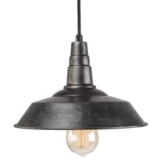 an industrial style light hanging from the ceiling