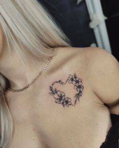 a woman with a tattoo on her chest