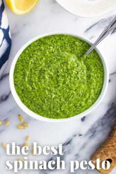 the best spinach pesto is in a white bowl