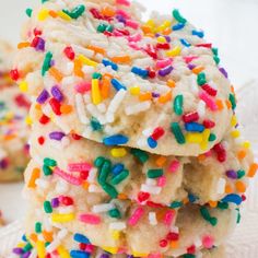 sprinkle covered cookies stacked on top of each other