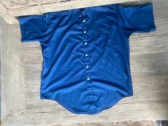 "This deep blue, genuine 1970s vintage, short sleeve, butterfly collared shirt is in excellent vintage condition. SIZE: Pit to Pit: 25\" Collar to hem: 31\" Sleeves: 11\" The tag does not have a size. Check the measurements. I would say it fits like a roomy XL The male mannequin would be 5'10\" 170 lbs. ITEM 125" Classic Blue Shirt With Collared Neckline, Vintage Solid Color Short Sleeve Shirt, Retro Blue Collared Short Sleeve Shirt, Blue Retro Collared Short Sleeve Shirt, Vintage Blue Collared Short Sleeve Shirt, Classic Blue Short Sleeve Shirt, Retro Blue Short Sleeve Shirt, Formal Short Sleeve Blue Tops, Formal Blue Short Sleeve Top