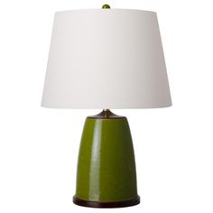 a green table lamp with a white shade on the top and brown trim around the base