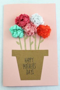 a mothers day card with flowers in a flower pot on top of pink paper and the words happy mother's day