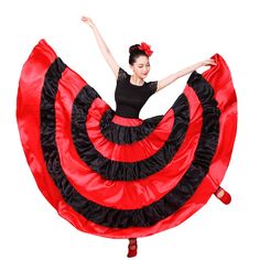 a woman in a red and black dress is dancing