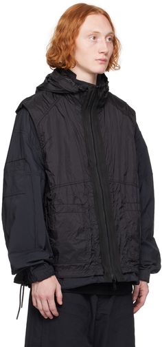 Reversible oversized lightweight polyester poplin jacket. Detachable reverse in black nylon ripstop. · Bungee-style drawstring at hood · Two-way zip closure · Zip pockets · Bungee-style drawstring at waist and hem · Raglan sleeves · Patch pocket at sleeve · Adjustable press-stud tab at elasticized cuffs Supplier color: Black Black Nylon Parka With Drawstring Hood, Utility Nylon Hooded Jacket With Double-lined Hood, Oversized Nylon Outerwear With Adjustable Hood, Utility Nylon Outerwear With Double-lined Hood, Black Nylon Track Jacket With Detachable Hood, Black Nylon Utility Hooded Jacket, Oversized Nylon Parka For Outdoor, Utility Nylon Windbreaker With Double-lined Hood, Utility Style Nylon Hooded Track Jacket